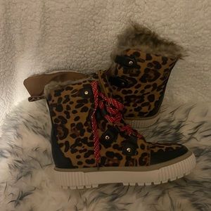 Brand new light weight winter boots, still in box, gift. To small